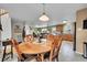 Spacious dining room with an open layout, seamlessly connecting to the kitchen and living area at 11285 Iola St, Commerce City, CO 80640