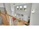 Bright entryway with high ceilings, large windows, and a view of the living room from the top of the staircase at 11285 Iola St, Commerce City, CO 80640