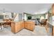 Open concept kitchen with an island that transitions to the living and dining rooms. Stainless steel appliances at 11285 Iola St, Commerce City, CO 80640