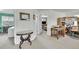 Open loft area showcasing a desk, office space, and an adjacent bedroom with an open door at 11285 Iola St, Commerce City, CO 80640