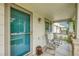 Inviting covered front porch with seating area, perfect for relaxing and enjoying the neighborhood view at 11285 Iola St, Commerce City, CO 80640