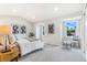 Cozy bedroom with natural light, neutral carpet, and stylish decor at 3713 S Ensenada St, Aurora, CO 80013