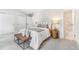 Bright bedroom with neutral tones, plush carpet, and an ensuite bathroom featuring marble tile at 3713 S Ensenada St, Aurora, CO 80013