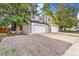 Charming two-story home with a two-car garage and well-maintained landscaping, providing curb appeal at 3713 S Ensenada St, Aurora, CO 80013