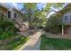 Beautiful courtyard showcasing lush greenery, walkway, and building exteriors on a sunny day at 1470 S Quebec Way # 245, Denver, CO 80231
