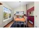 Cozy dining room with hardwood floors, a large window for natural light, and modern decor at 1470 S Quebec Way # 245, Denver, CO 80231