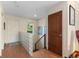 Welcoming entryway with wood floors, glass block accent, and natural light, offering a warm greeting at 1470 S Quebec Way # 245, Denver, CO 80231