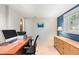 Bright home office featuring a spacious desk area, natural light and adjacent storage cabinets at 1470 S Quebec Way # 245, Denver, CO 80231