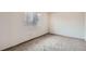 Bright bedroom with neutral walls, carpet flooring, and a window offering natural light at 18091 E Kentucky Ave # 202, Aurora, CO 80017