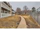 Exterior view of the building with walking path to common areas in the surrounding community at 18091 E Kentucky Ave # 202, Aurora, CO 80017