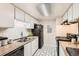 Functional kitchen with white cabinets, black appliances, and ample counter space at 18091 E Kentucky Ave # 202, Aurora, CO 80017