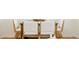 Close up of a modern dining table with white upholstered chairs and neutral decor at 930 S Lowell Blvd, Denver, CO 80219