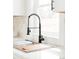 Close up of kitchen sink, featuring modern faucet and countertops at 930 S Lowell Blvd, Denver, CO 80219