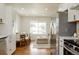 Bright and airy living space with hardwood floors, an open floor plan, and lots of natural light at 930 S Lowell Blvd, Denver, CO 80219