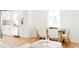 Bright living room with hardwood floors, an open floor plan, and lots of natural light at 930 S Lowell Blvd, Denver, CO 80219