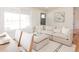 Bright living room with hardwood floors, an open floor plan, and lots of natural light at 930 S Lowell Blvd, Denver, CO 80219