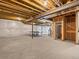 Unfinished basement with concrete floors, exposed ceiling, and ping pong table at 11999 S Stroll Ln, Parker, CO 80138