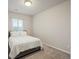 Bedroom with carpet flooring, a double bed, and a large window letting in natural light at 11999 S Stroll Ln, Parker, CO 80138