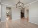 Open dining room with hardwood floors and elegant chandelier at 11999 S Stroll Ln, Parker, CO 80138