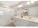 Modern bathroom featuring a double sink vanity, walk-in shower, and neutral tones at 6543 13Th St, Frederick, CO 80530