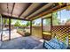 Enclosed porch with swing, lighting, and an open view of the backyard, perfect for relaxing at 6598 S Logan St, Centennial, CO 80121