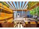 Outdoor patio with wood swings, hammock, pergola, and backyard shed offers comfortable backyard space at 6598 S Logan St, Centennial, CO 80121