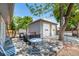 Backyard features a deck, a two-car garage, and seating, perfect for outdoor entertaining at 6598 S Logan St, Centennial, CO 80121