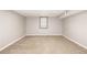Basement bedroom features neutral paint, and window at 6598 S Logan St, Centennial, CO 80121