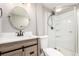 Remodeled bathroom with stylish vanity, new fixtures, and glass enclosed shower at 6598 S Logan St, Centennial, CO 80121
