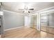 Large bedroom boasts hardwood floors, ceiling fan, and mirrored sliding door closet at 6598 S Logan St, Centennial, CO 80121