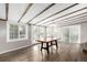 Bright dining area with wood floors, an exposed beam ceiling, and lots of natural light at 6598 S Logan St, Centennial, CO 80121