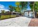 Expansive driveway with two-car garage provides ample parking and a fenced backyard with lawn at 6598 S Logan St, Centennial, CO 80121