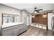 Modern kitchen with white countertops, stainless steel appliances, and seamless view into dining area at 6598 S Logan St, Centennial, CO 80121