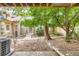 This outdoor space features beautiful landscaping including a large tree and shrubs at 11155 W 17Th Ave # 103, Lakewood, CO 80215