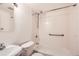 Bright bathroom features white tile, a shower/tub combination, and updated fixtures at 11155 W 17Th Ave # 103, Lakewood, CO 80215
