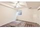 A simple bedroom featuring carpet, a ceiling fan, and a window with natural light at 11155 W 17Th Ave # 103, Lakewood, CO 80215
