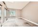 This spacious bedroom features neutral walls, plush carpeting, and a sunny window with outdoor views at 11155 W 17Th Ave # 103, Lakewood, CO 80215