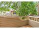 View from the deck showing mature trees and surrounding rooftops in the neighborhood at 11155 W 17Th Ave # 103, Lakewood, CO 80215