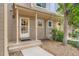 Inviting front porch featuring a concrete path leading to the front door of the two-story home at 11155 W 17Th Ave # 103, Lakewood, CO 80215