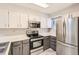 Modern kitchen with stainless steel appliances, ample counter space, and stylish cabinetry at 11155 W 17Th Ave # 103, Lakewood, CO 80215