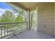 Balcony showcasing a serene neighborhood view framed by lush green trees and a bright sky at 3375 Boulder Cir # 204, Broomfield, CO 80023