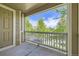 Outdoor balcony offering a peaceful view of the surrounding green trees and blue sky at 3375 Boulder Cir # 204, Broomfield, CO 80023