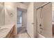 Bathroom with a shower/tub, featuring a view into the hallway and another room at 3375 Boulder Cir # 204, Broomfield, CO 80023
