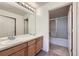 Bathroom featuring double sinks, vanity and shower-tub combo at 3375 Boulder Cir # 204, Broomfield, CO 80023