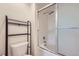 Well-lit bathroom featuring tub, toilet and shower with sliding glass door at 3375 Boulder Cir # 204, Broomfield, CO 80023