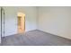 Bedroom featuring carpet, neutral decor, archway and access to bathroom at 3375 Boulder Cir # 204, Broomfield, CO 80023