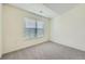 Bright bedroom with a large window and plush gray carpet creates a relaxing and inviting space at 3375 Boulder Cir # 204, Broomfield, CO 80023