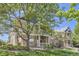 Beautiful townhome with stone accents, a manicured lawn, mature trees and a covered porch to enjoy the view at 3375 Boulder Cir # 204, Broomfield, CO 80023