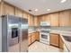 Bright kitchen featuring stainless steel refrigerator, modern appliances and an abundance of natural light at 3375 Boulder Cir # 204, Broomfield, CO 80023