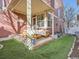 Outdoor patio with furniture and manicured artificial grass at 8367 Devinney St, Arvada, CO 80005